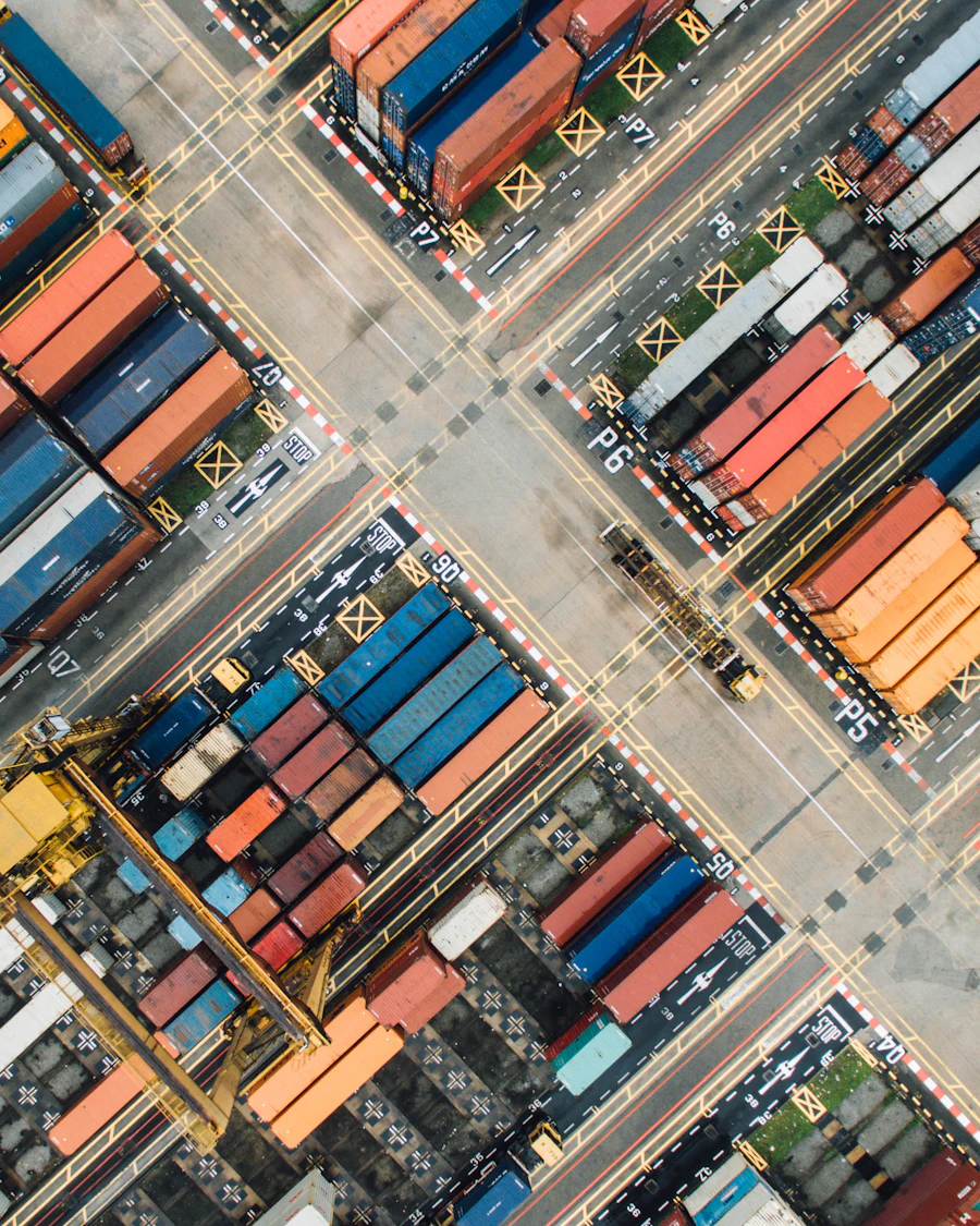 Concept: aerial view of a container yard in rows of colour